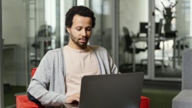 man-working-laptop-company-scaled.jpg